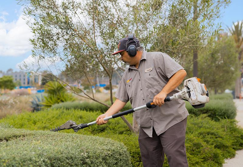 employee working on landscaping